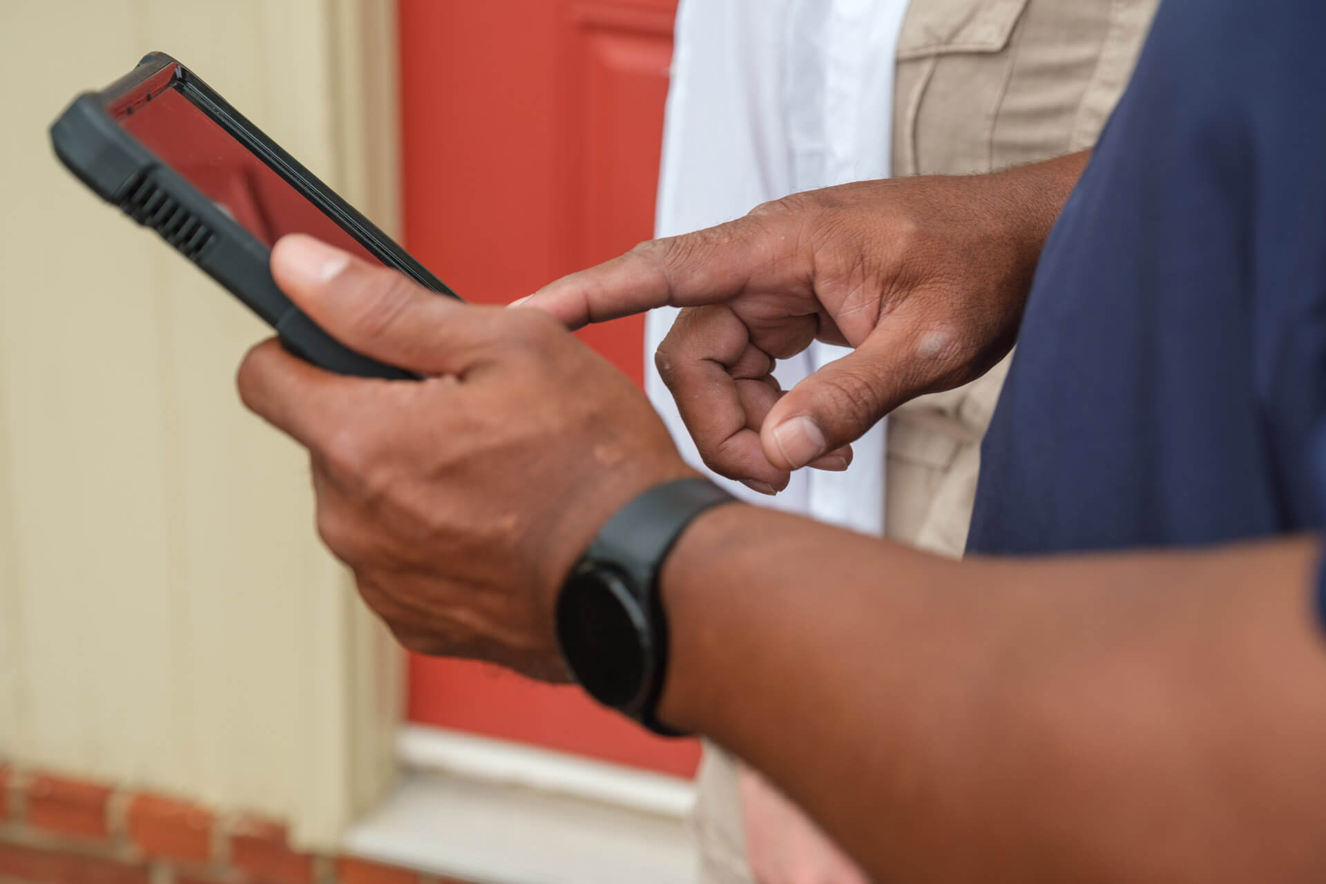 A Carolina Heating Service watching a camera inspection on a digital tablet device - Carolina Heating Service Inc. A Carolina Heating Service technician watching a camera inspection on a digital tablet device