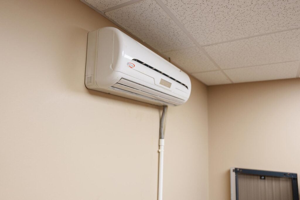 A Mini-Split unit mounted on a wall inside of a home or office